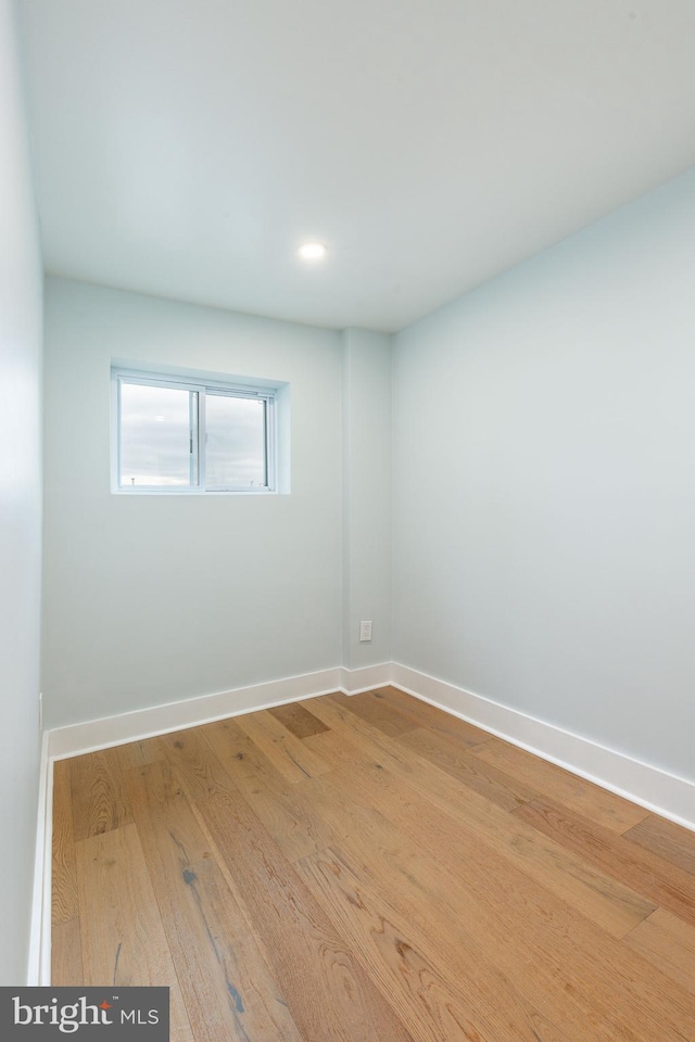 unfurnished room with light hardwood / wood-style flooring