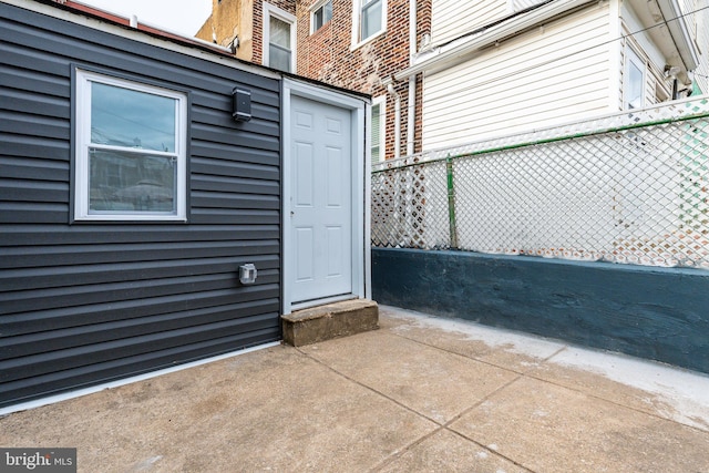 property entrance featuring a patio