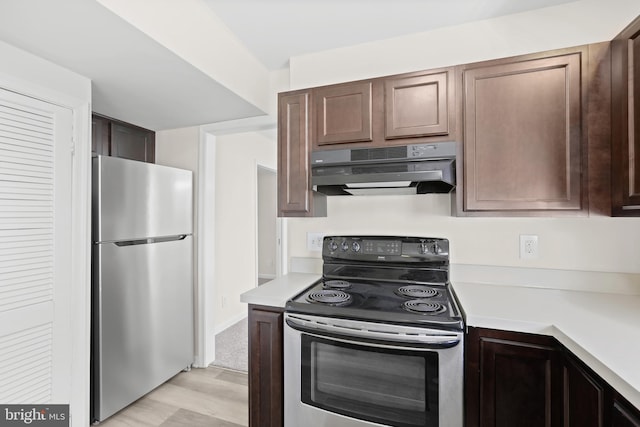 kitchen featuring dark brown cabinets and appliances with stainless steel finishes