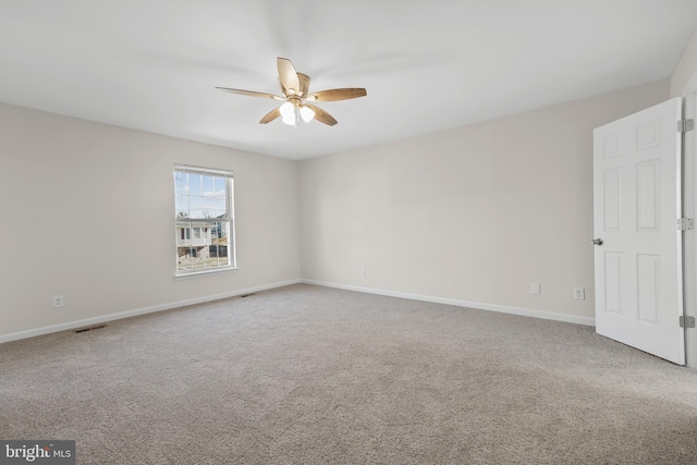 unfurnished room with ceiling fan and carpet floors