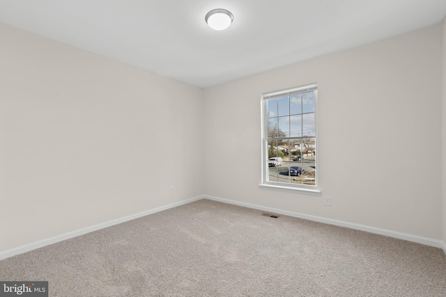 empty room featuring carpet flooring