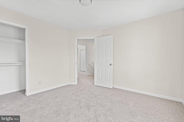 unfurnished bedroom featuring light colored carpet