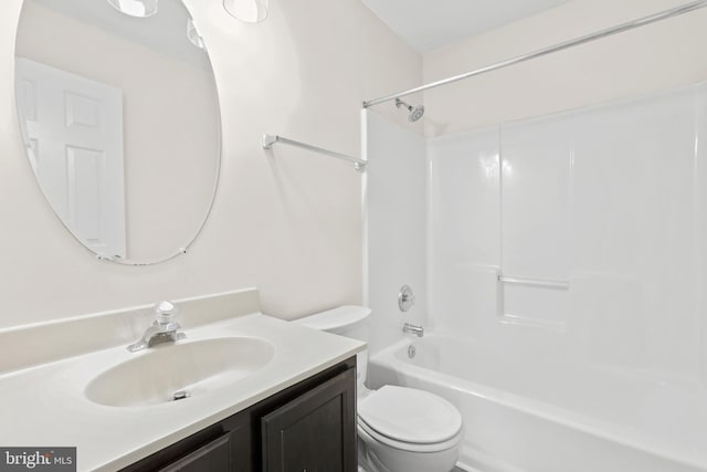 full bathroom featuring vanity,  shower combination, and toilet