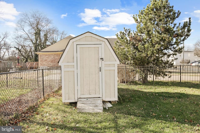 view of outbuilding with a lawn