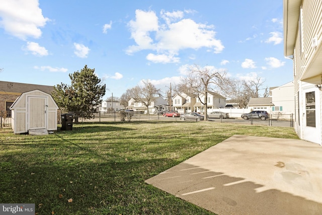 view of yard with a patio and a shed