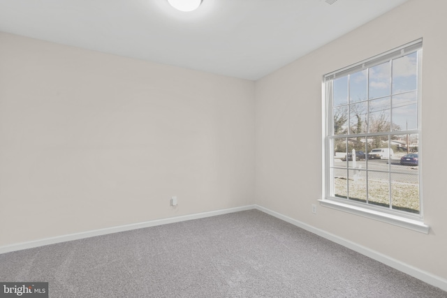 unfurnished room featuring carpet