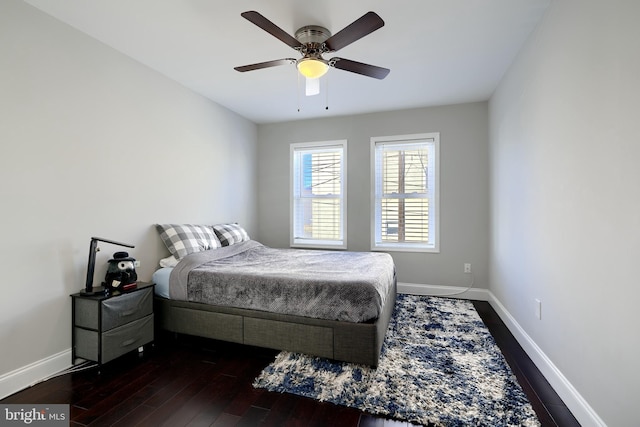 bedroom featuring ceiling fan and dark hardwood / wood-style flooring