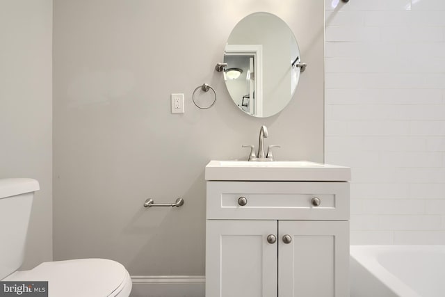 bathroom featuring vanity and toilet