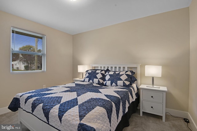 bedroom featuring light carpet