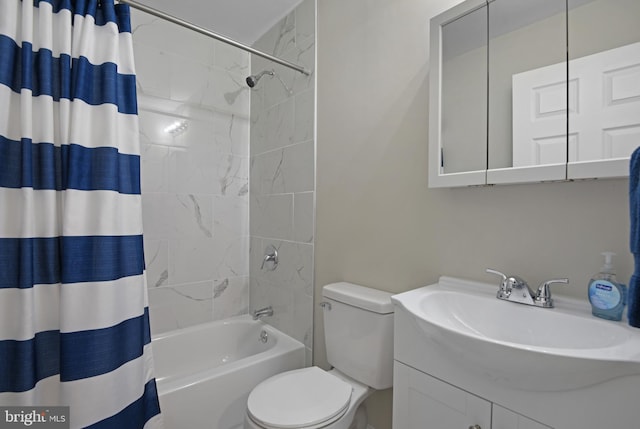 full bathroom featuring vanity, toilet, and shower / bath combo with shower curtain