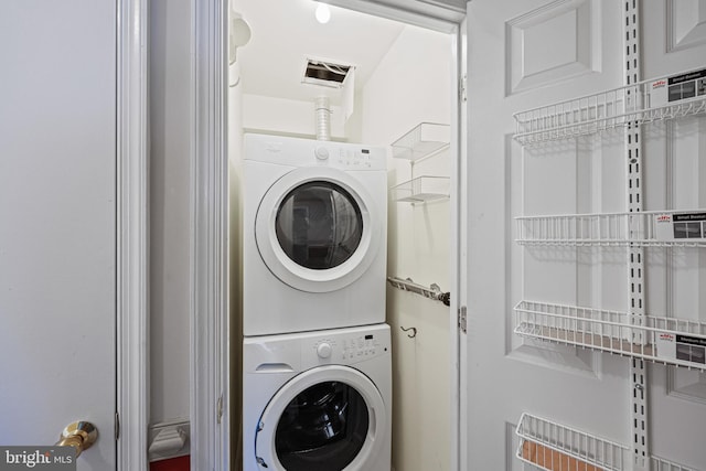 laundry room featuring stacked washing maching and dryer