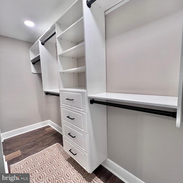 walk in closet featuring dark hardwood / wood-style floors