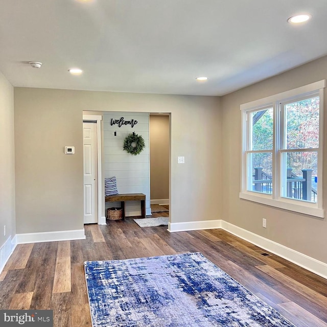 entrance foyer featuring dark hardwood / wood-style floors