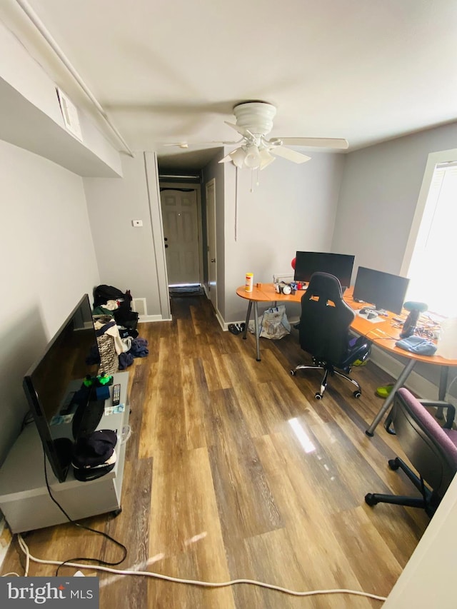 home office with ceiling fan and wood-type flooring