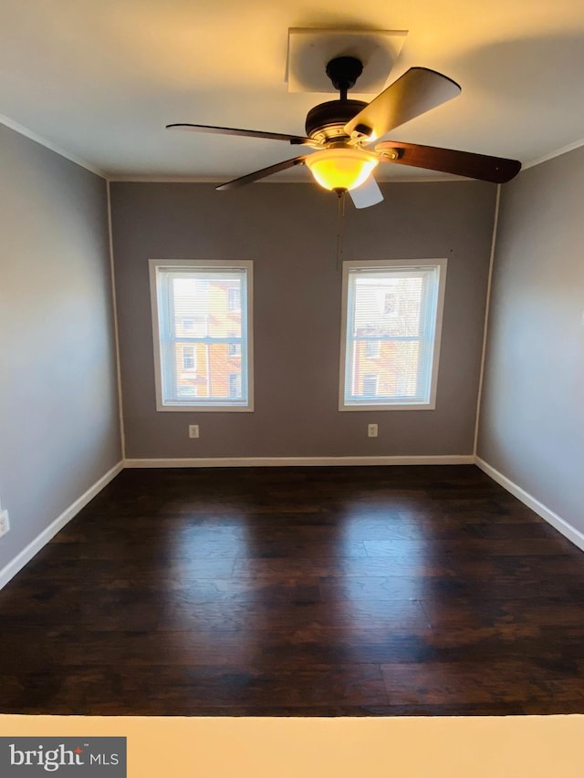 unfurnished room featuring ceiling fan, dark hardwood / wood-style floors, and plenty of natural light