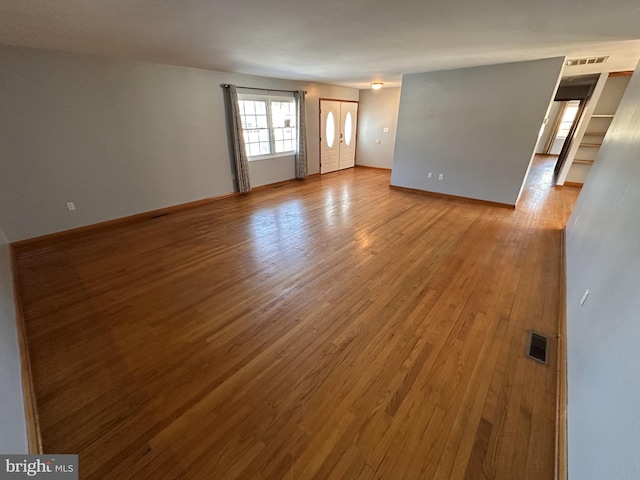 spare room with light hardwood / wood-style floors