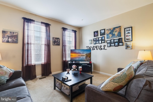 living room featuring light colored carpet