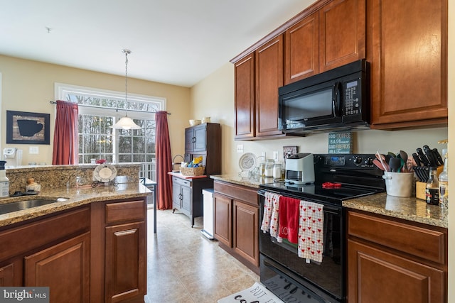 kitchen featuring sink, pendant lighting, light stone counters, and black appliances