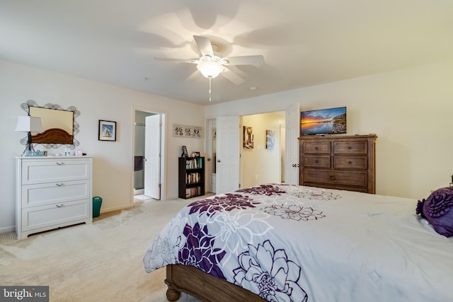 bedroom with ceiling fan and light colored carpet