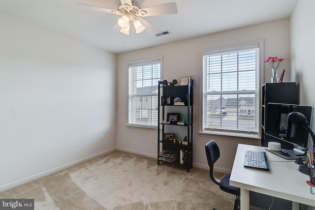 office space with ceiling fan and light colored carpet