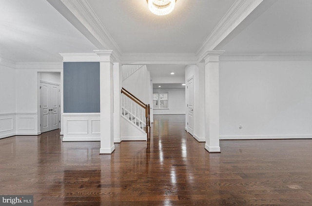 foyer with dark hardwood / wood-style flooring and ornamental molding