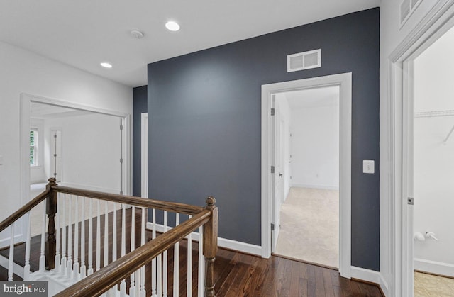 hall with dark hardwood / wood-style flooring