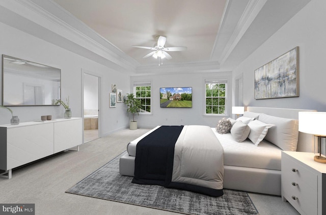 bedroom with light carpet, a raised ceiling, crown molding, ceiling fan, and connected bathroom