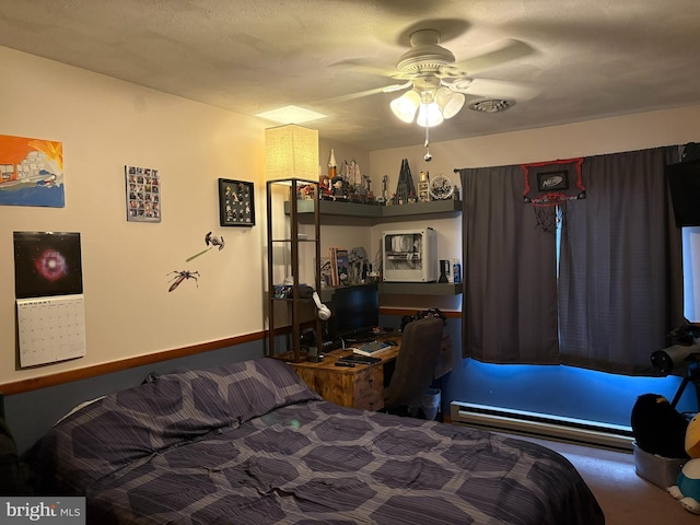 carpeted bedroom with ceiling fan, a textured ceiling, and a baseboard radiator