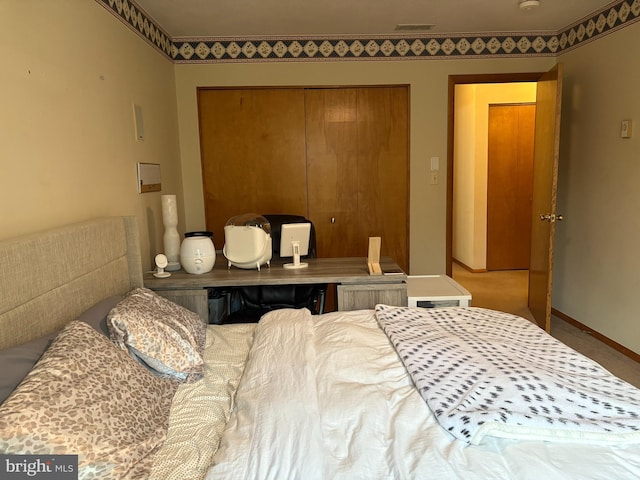 bedroom with carpet floors and a closet