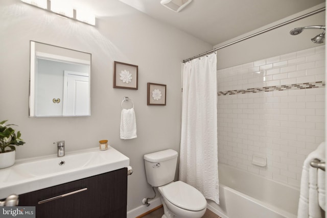 full bathroom featuring vanity, toilet, and shower / bath combo with shower curtain