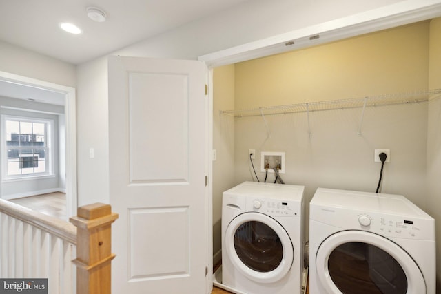 laundry area with independent washer and dryer