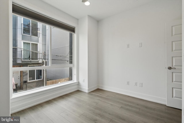 unfurnished room featuring hardwood / wood-style floors