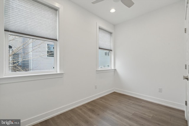 unfurnished room with wood-type flooring and ceiling fan