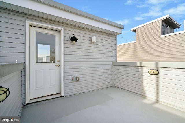 property entrance featuring a patio area