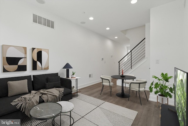 living room with dark hardwood / wood-style flooring