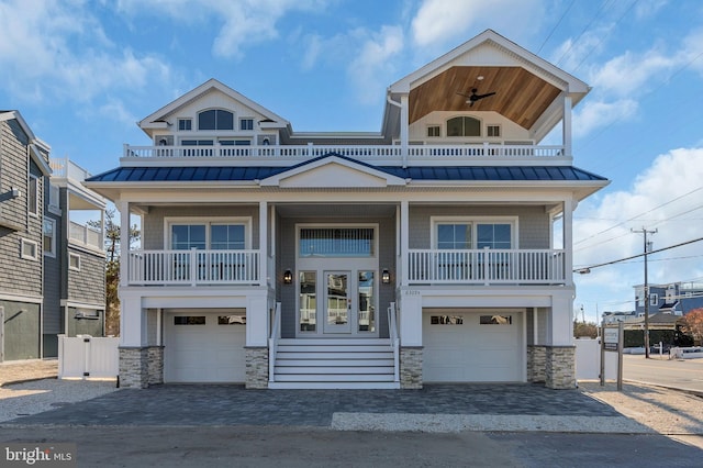 view of front facade featuring a balcony and a garage