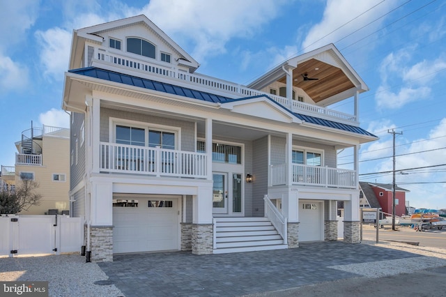 view of front of home featuring a balcony and a garage