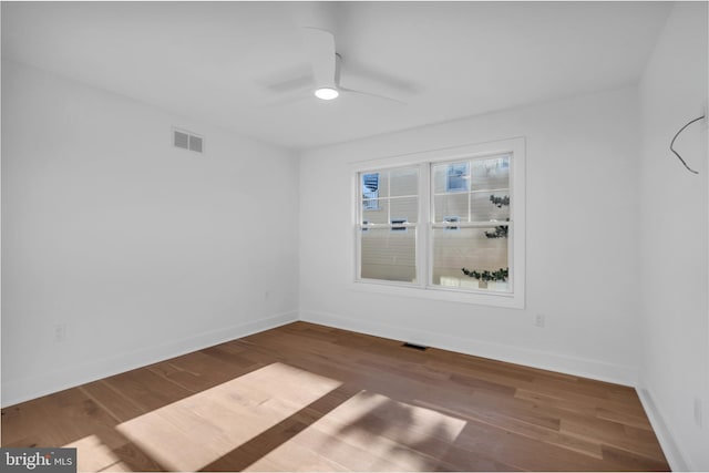 unfurnished room featuring hardwood / wood-style flooring and ceiling fan