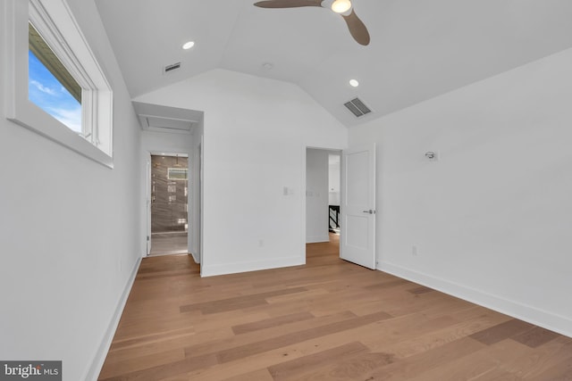 unfurnished bedroom featuring vaulted ceiling, light hardwood / wood-style floors, and ceiling fan