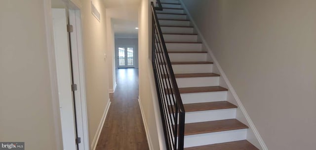 staircase featuring hardwood / wood-style floors