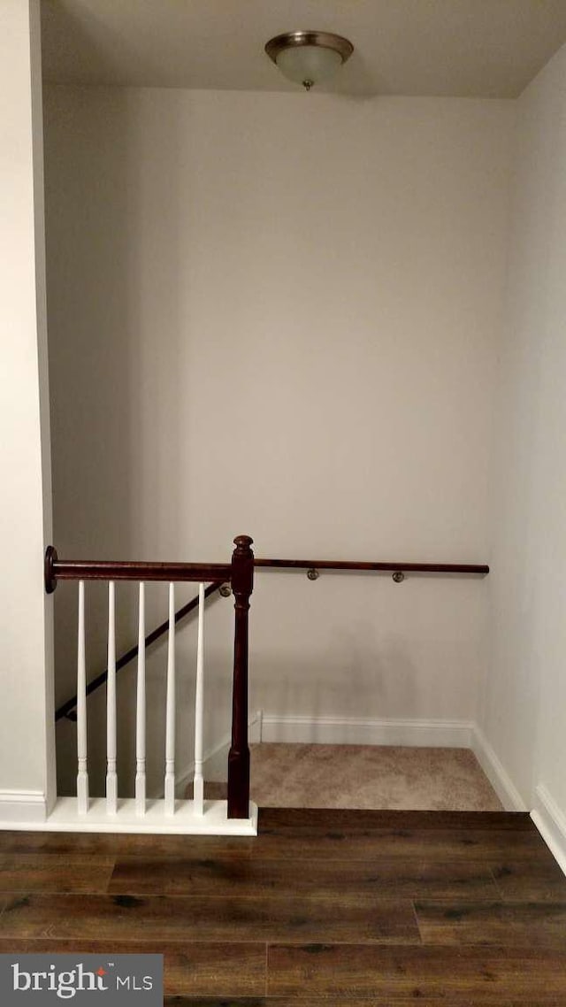 stairs with hardwood / wood-style floors