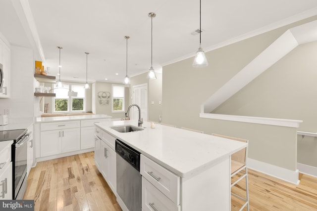 kitchen with sink, hanging light fixtures, an island with sink, white cabinets, and appliances with stainless steel finishes