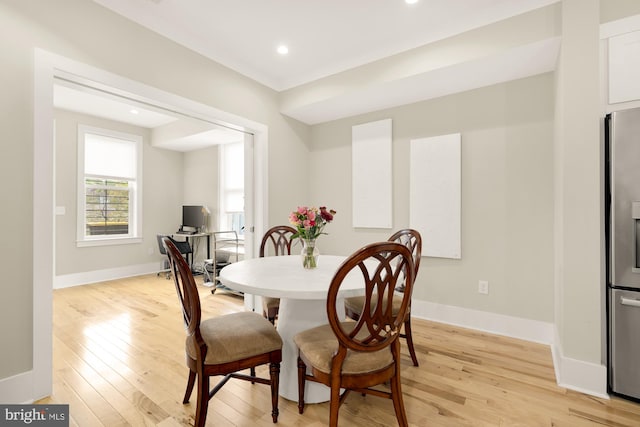 dining area with light hardwood / wood-style flooring