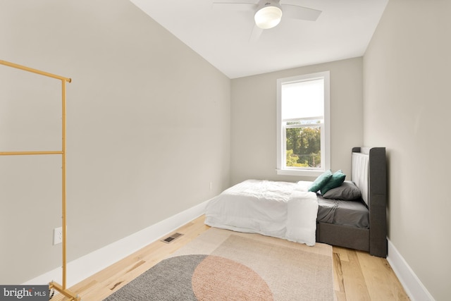 bedroom with ceiling fan and light hardwood / wood-style flooring