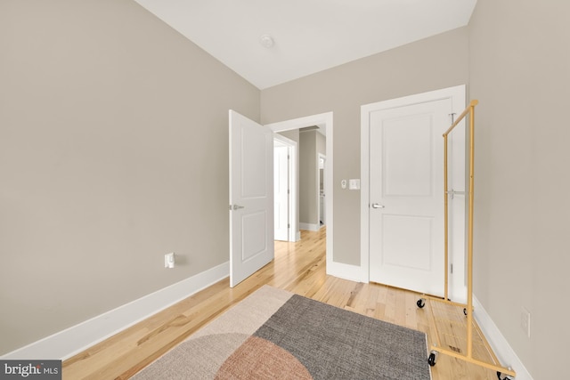 bedroom with hardwood / wood-style floors