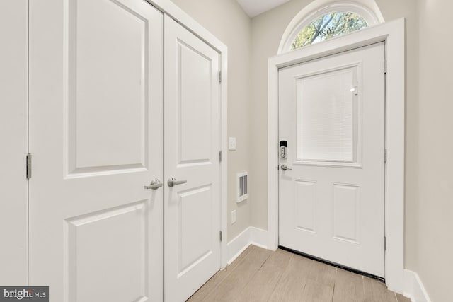 doorway to outside with light hardwood / wood-style floors