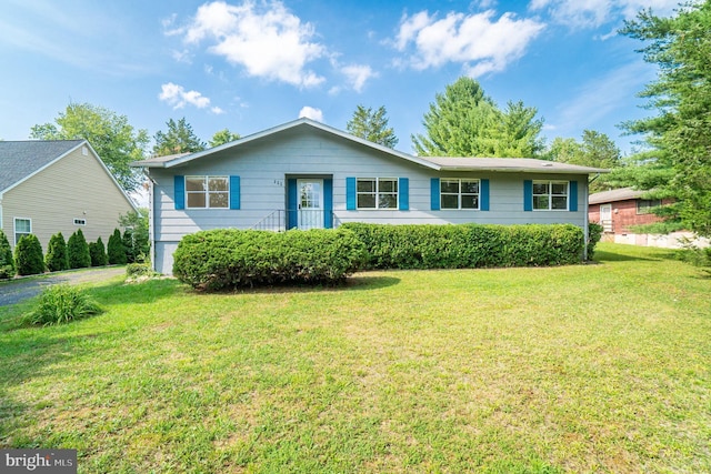 single story home with a front yard