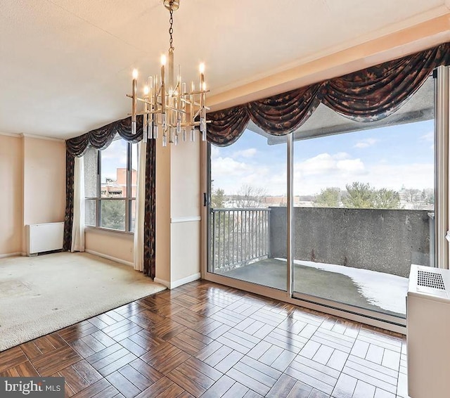 unfurnished dining area featuring parquet floors and a notable chandelier