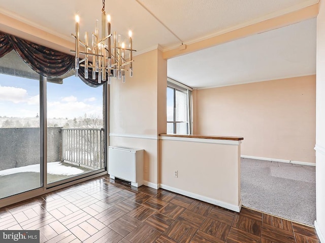 unfurnished room with parquet flooring, crown molding, and a chandelier