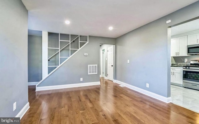 unfurnished dining area featuring light hardwood / wood-style floors